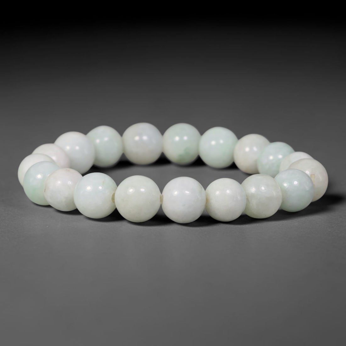 Natural Burmese Type A Pale Green White Jadeite Jade Round Bead Bracelet, 83TK: Polished from natural Burmese Type A jadeite, this bracelet features smooth round pale green white beads measuring 10.7mm. It presents milky white bases softened by delicate pale green clouding and su
