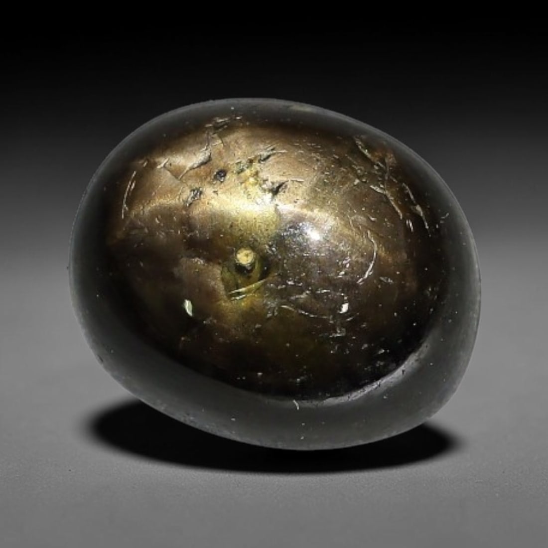 5.55ct Natural Siamese 6-Ray Black Star Sapphire Loose Gemstone, 68WW: This polished star sapphire originates from classic Siamese mining deposits, featuring a deep dark crystalline base with fine native mineral traces trapped within its structure, sized at calibrated 9x