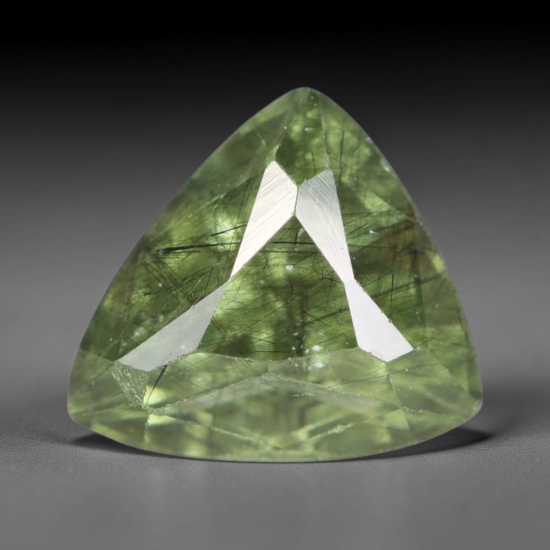 3.68 Carats Natural Green Rutilated Peridot Faceted Loose Gemstone, 75XY: This peridot is mined from natural earth deposits and refined with precise faceting and glossy surface polishing by professional lapidary techniques. Fine needle-like rutile filaments dispersed inside