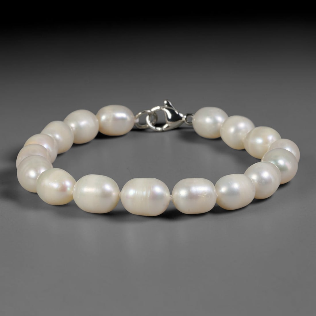 Natural Freshwater Pearl Bracelet - Baroque Luminous White Pearl Strand, 94YM: Composed of smooth organic baroque natural freshwater pearls with uniform luminous white pearlescent luster, each bead bearing soft asymmetrical oval contours formed through natural freshwater pearl c