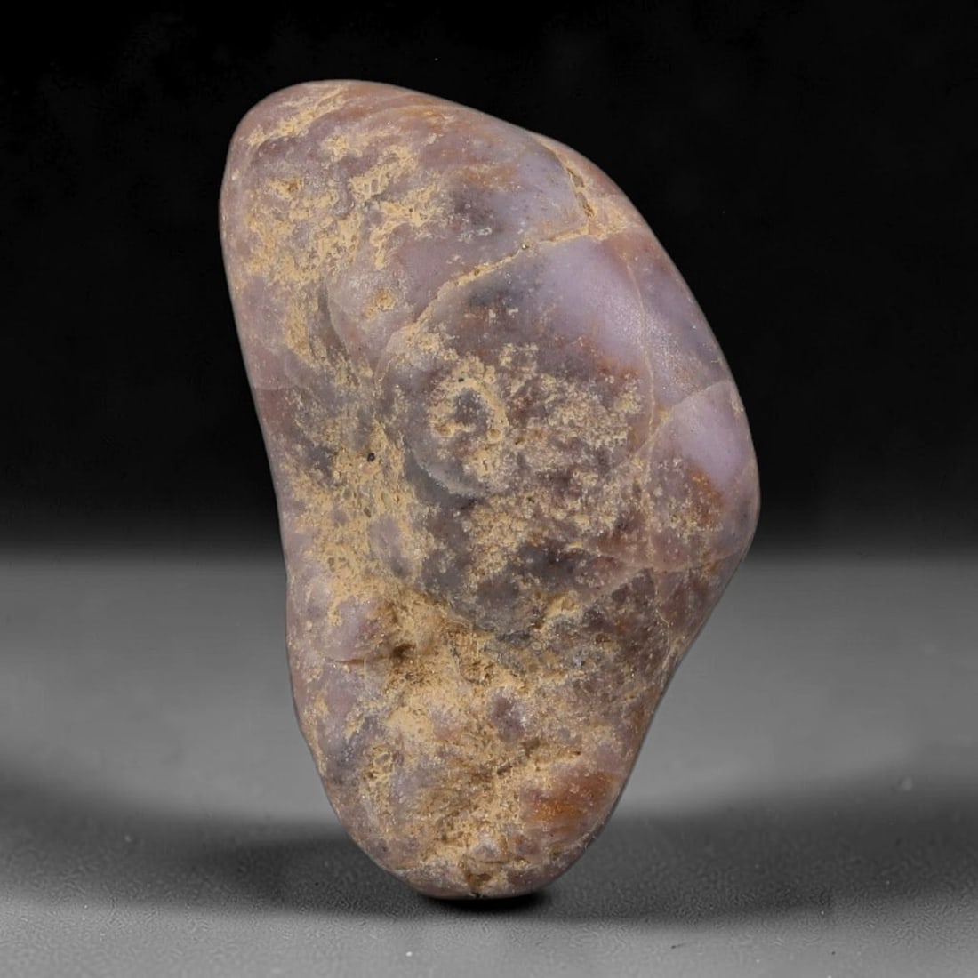 24ct Natural Unheated Sri Lankan Purplish Blue Sapphire Rough, 40YQ: This natural corundum rough is an unheated purplish blue sapphire sourced from Sri Lankan alluvial gem deposits, featuring an irregular natural native form with residual pale yellow-brown mineral matr