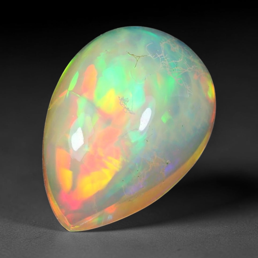 3.17ct Natural Ethiopian Welo Solid Opal Oval Cabochon Loose Gemstone, 59TG: Solid opal cabochon mined from Ethiopia's Welo opal deposits, polished into a smooth elongated oval dome with high reflective gloss. The translucent pale milky base hosts broad shifting play-of-color 