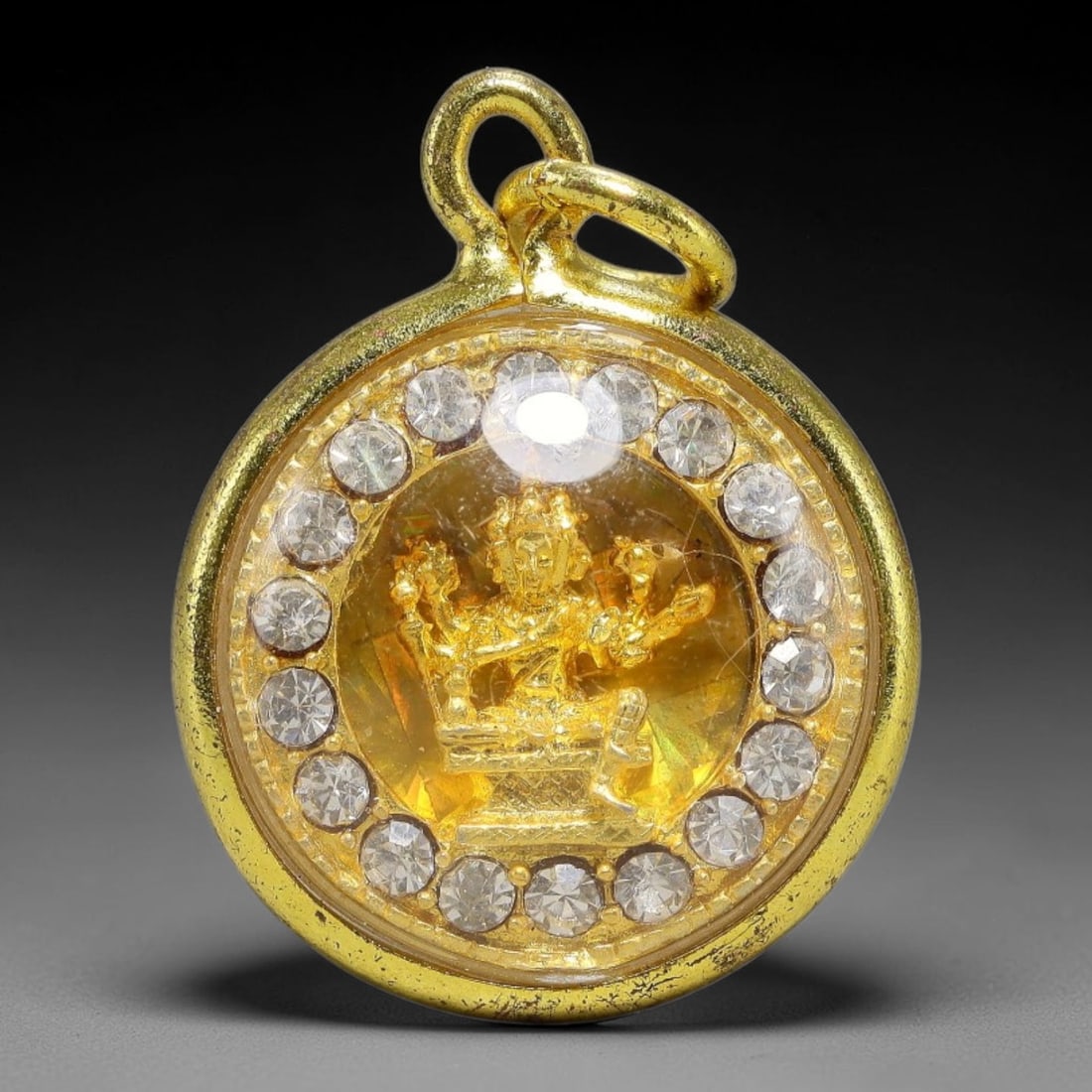 Thai Four-Faced Phra Phrom Dual-Sided Round Gold Plated Rhinestone Casing Amulet, 75YY: Mini round Thai Phra Phrom (Four-Faced Buddha) amulet with gold metal core sealed under transparent protective cover, housed in polished gold-plated round frame fully encircled by clear round rhinesto
