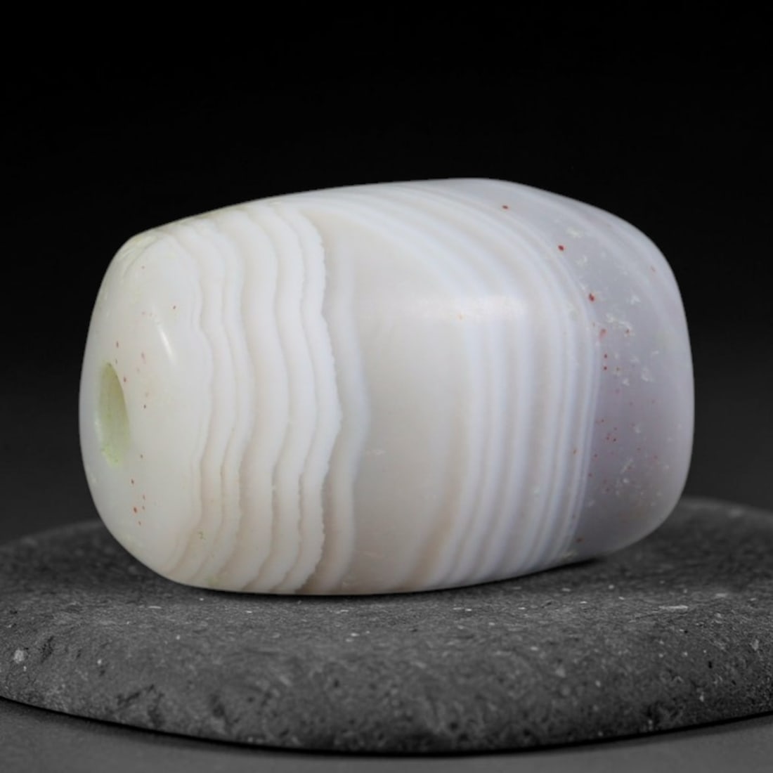Ancient Sogdian Mini White Banded Agate Short Barrel Amulet Bead (500-1000 CE), 50XD: This diminutive antique short barrel banded agate bead was crafted by Sogdian Silk Road merchant artisans, who produced compact miniature chalcedony talismans for stacking multi-bead necklaces and per