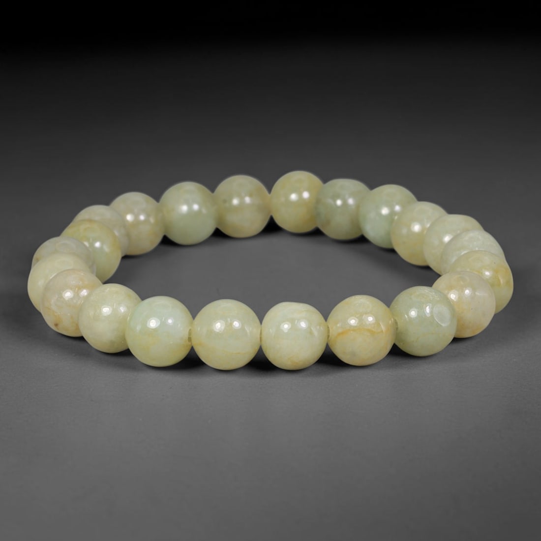 Natural Burmese Type A Pale Celadon Jadeite Jade Beaded Bracelet, 88TA: Crafted from fully untreated authentic Burmese Type A jadeite, this bracelet features uniformly smooth polished round beads in a soft pale celadon base hue, interspersed with subtle natural warm yello