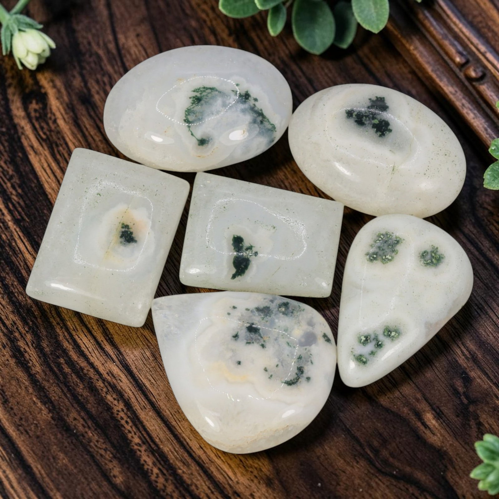 294.72 Carats Natural Solar Quartz Mixed Shape Cabochon Lot, 28WC: This parcel contains six polished natural solar quartz cabochons featuring unique internal dendritic green mineral inclusions, with distinct artistic patterning on every individual stone. These caboch