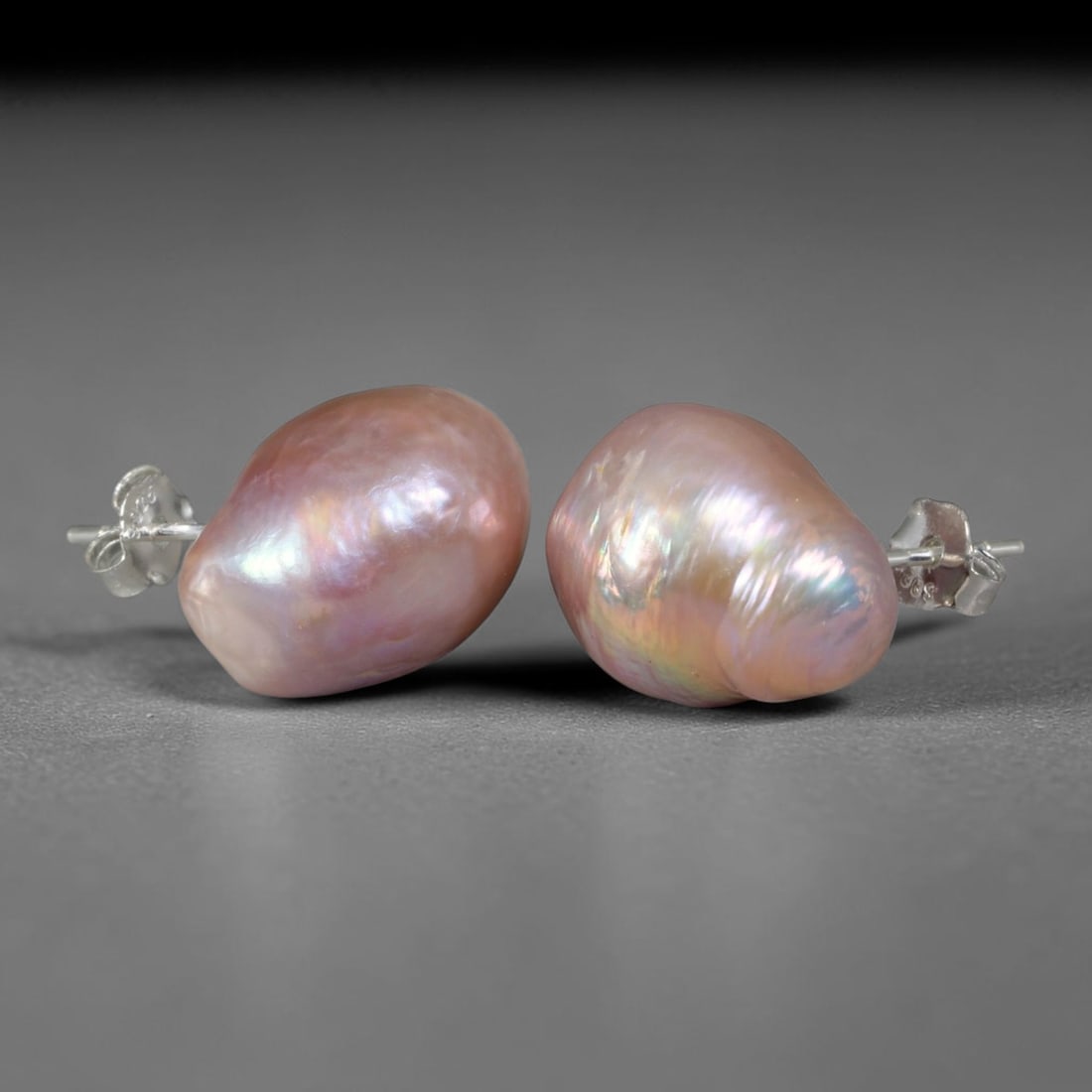 Natural Baroque Blush Pink Teardrop Pearl Stud Earrings, 43WE: Elegant matched stud earrings featuring organic asymmetrical teardrop baroque freshwater pearls, each sized 14.6x10.3mm. The pearls are coated in thick luminous nacre dominated by soft dusty blush pin