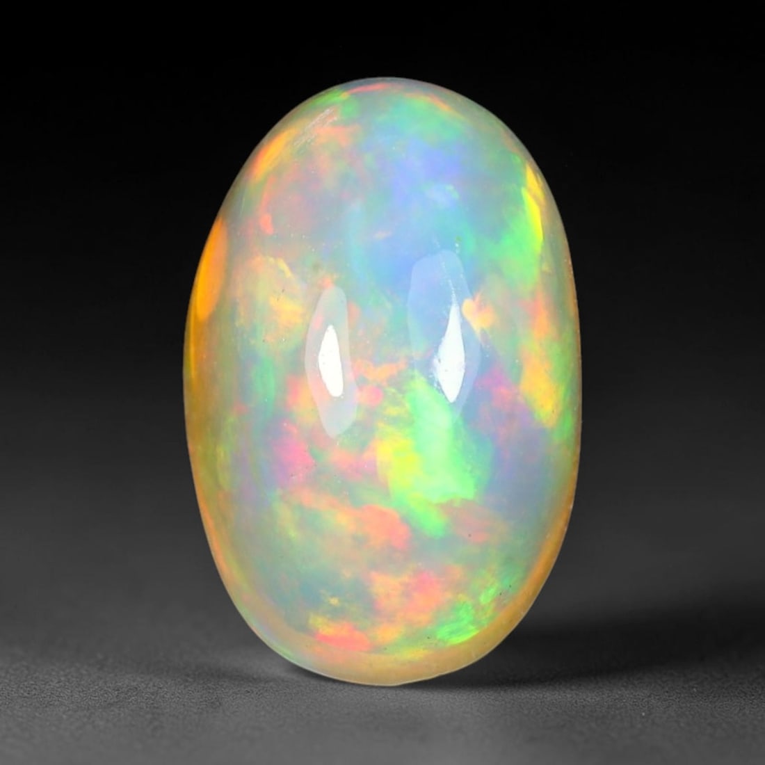 2.92ct Natural Multicolor Fire Ethiopian Welo Solid Opal Cabochon Loose Gemstone, 30TG: Formed from natural silica deposits within Ethiopian mineral veins, this solid opal cabochon is polished to a smooth domed surface that displays inherent light refraction traits. The stone carries wid