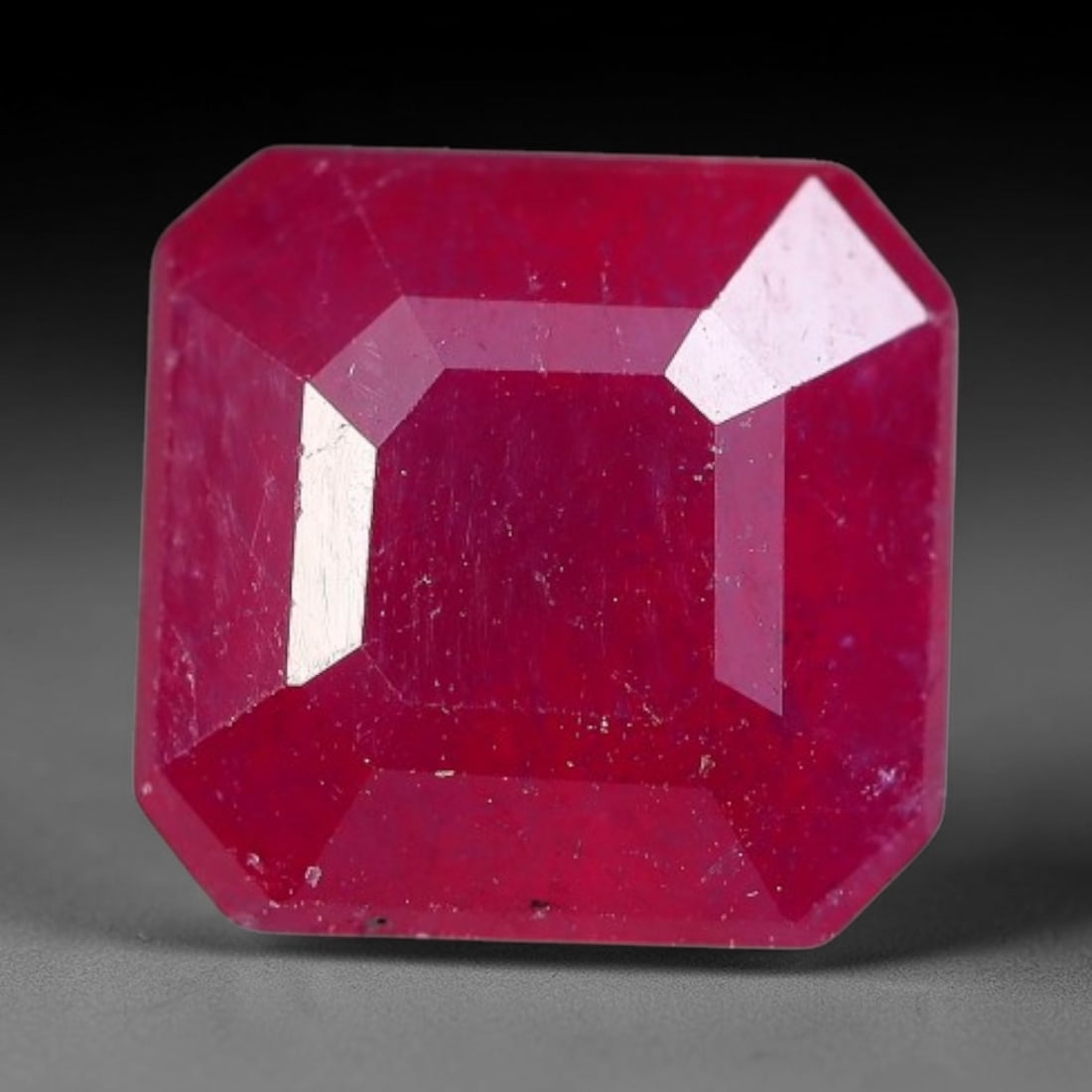 2.50 Carats Natural Madagascar Ruby Square Cushion Cut Loose Gemstone, 68XM: This natural Madagascar ruby is crafted into a square cushion modified step cut, displaying vivid saturated crimson red color typical of Malagasy corundum. Fine scattered mineral inclusions, subtle in