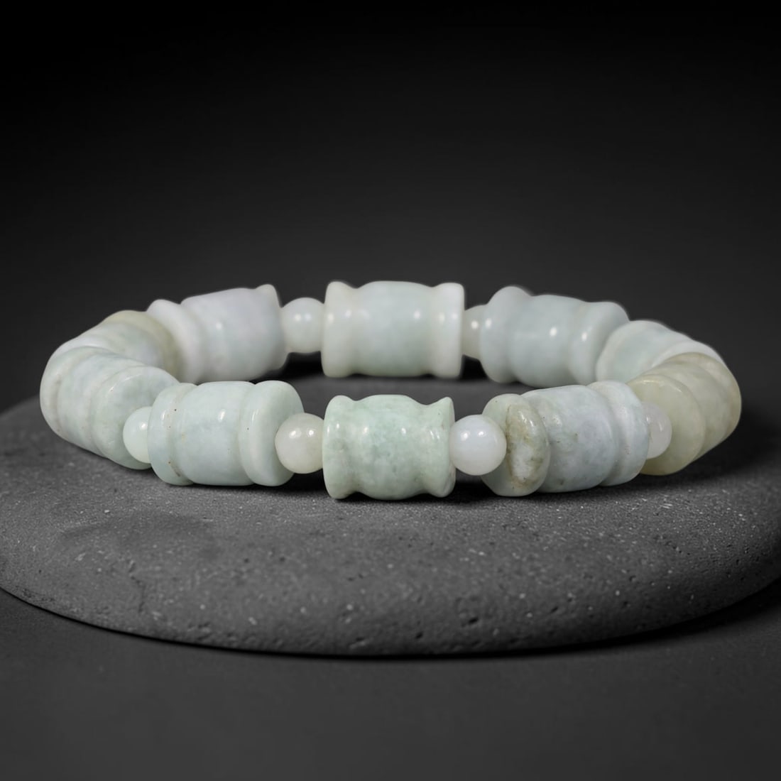 Natural Burmese Type A Pale Celadon Barrel Shape Jadeite Jade Bead Bracelet, 84TK: Polished from natural Burmese Type A jadeite, this bracelet features carved pale celadon barrel shape beads measuring 11.7mm, spaced with small round jadeite spacer beads. It displays soft pale celado