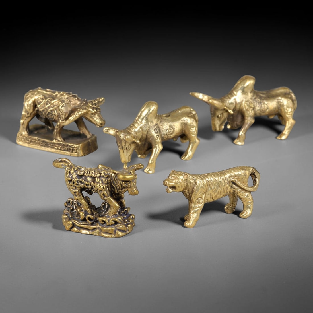Vintage Copper Alloy Chinese Zodiac Ox & Tiger Feng Shui Mini Statues - 5pcs Set, 3YZ: Vintage copper alloy feng shui miniature animal figurine set of five pieces, each sized 3.0x2.0cm. The collection includes four elaborately patterned ox statues with embossed auspicious cloud motifs o