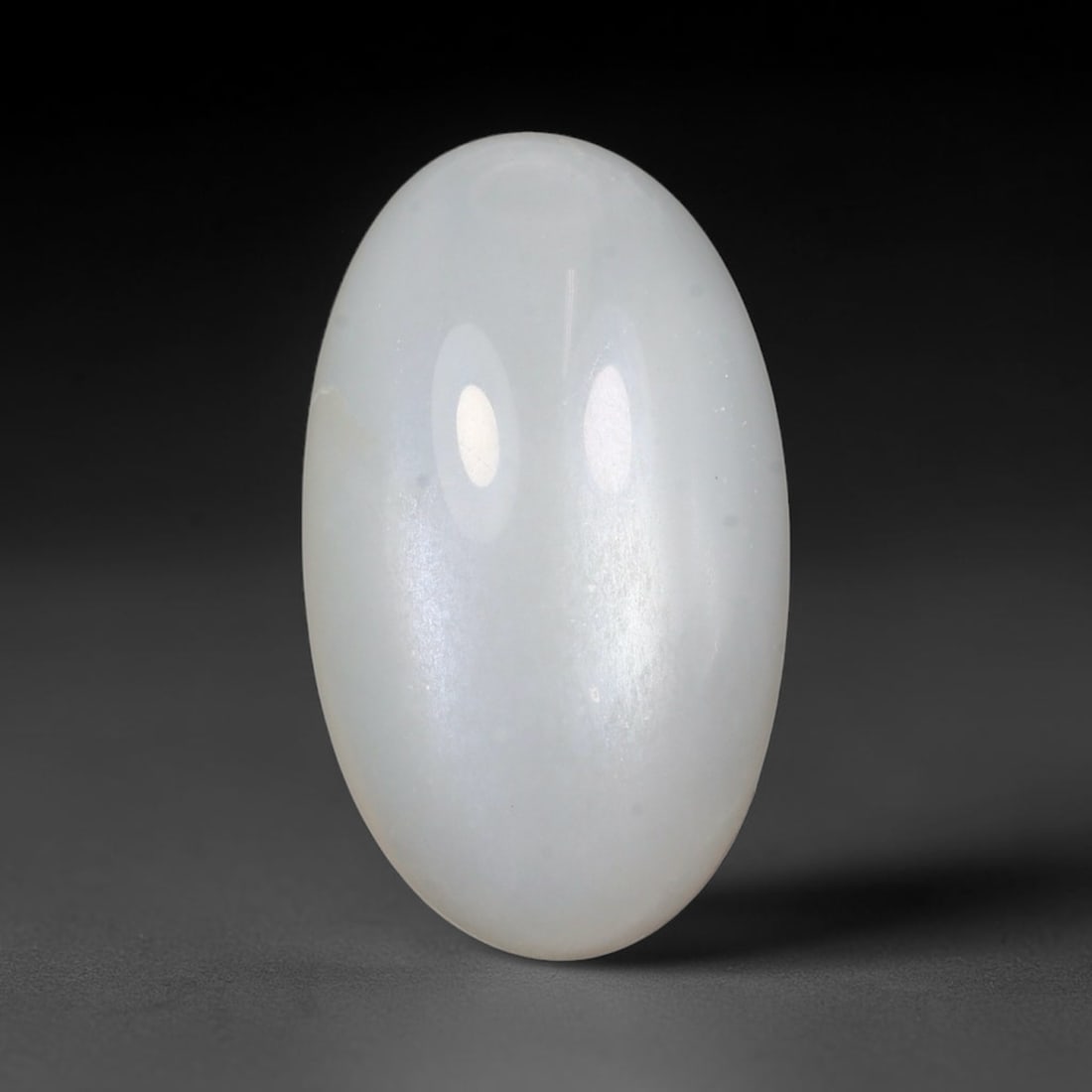 16.94 Carats Natural Ceylon White Moonstone Loose Gemstone, 39WJ: This natural Ceylon white moonstone holds dimensions of 22x13x7.9mm, a well-polished natural feldspar gemstone sourced from Ceylon's renowned moonstone mineral deposits famous for distinctive light sh