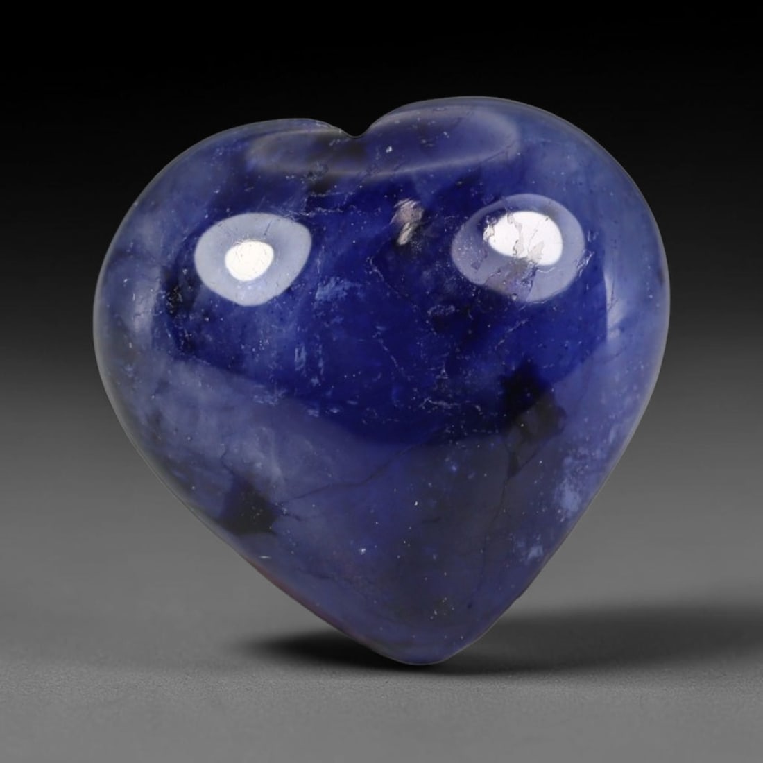 8.87 Carats Natural Madagascar Deep Royal Blue Heated Sapphire Heart Cabochon Loose Gemstone, 29WS: This rich deep royal blue sapphire cabochon carries layered saturated navy-blue tones across its smoothly polished heart domed face, with natural dark mineral patches, fine silk veining and tiny cryst