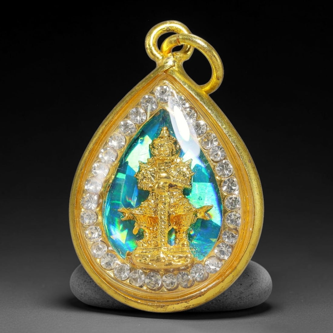 Thai Giant God Thao Wessuwan Dual-Sided Gold Plated Rhinestone Casing Amulet, 80YY: Mini teardrop-shaped Thai Thao Wessuwan amulet with gold metal core sealed under transparent cover, bordered by sparkling clear rhinestones and housed in polished gold-plated metal casing with matchin