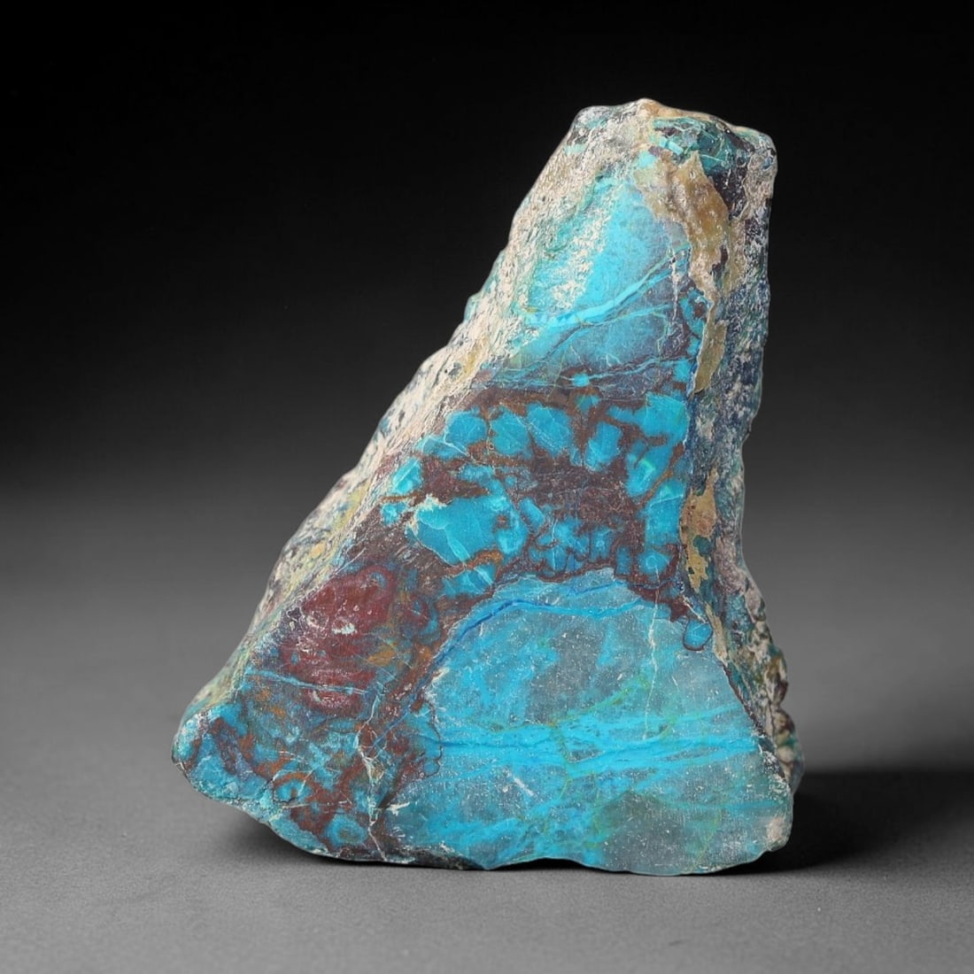 55ct Natural Peruvian Chrysocolla Polished Slab Rough, 66WV: This partial-polished chrysocolla slab features blended mineral matrix with smooth refined face and unaltered natural rugged edge across its 33x25x10mm elongated form, translucent mineral layers hold 