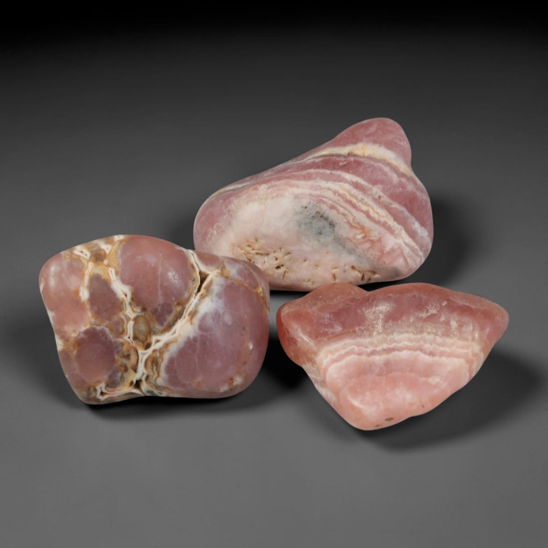 83ct 3pcs Natural Argentine Rhodochrosite Banded Tumbled Rough Set, 4YR: This listing features three individual tumbled rhodochrosite rough pieces sourced from Argentina Capillitas deposits, each showcasing distinct layered banding of soft rose pink, cream white and pale t