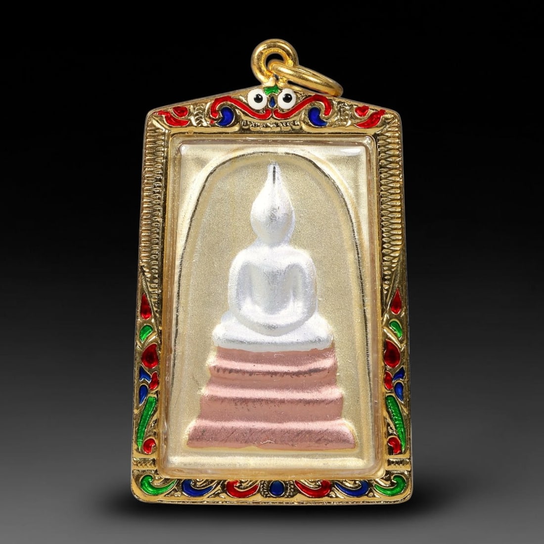 Thai Enamel Framed Buddha Votive Amulet - Gold Cased Pendant, 14YY: Hand-finished devotional tablet showcasing smooth white seated Buddha relief set upon layered pink stepped base inside a subtle molded arch. The surrounding gold casing is adorned with vibrant red, gr