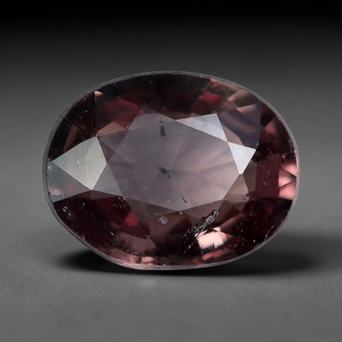 1.52 Carats Natural Smoky Rose Spinel Oval Gemstone, 1XZ: Let me share with you this really nice single oval faceted spinel with a rich muted rose-brown tone all its own. This stone measures 7.9x6.1x3.3mm and weighs 1.52 carats total. It carries a deep smoky