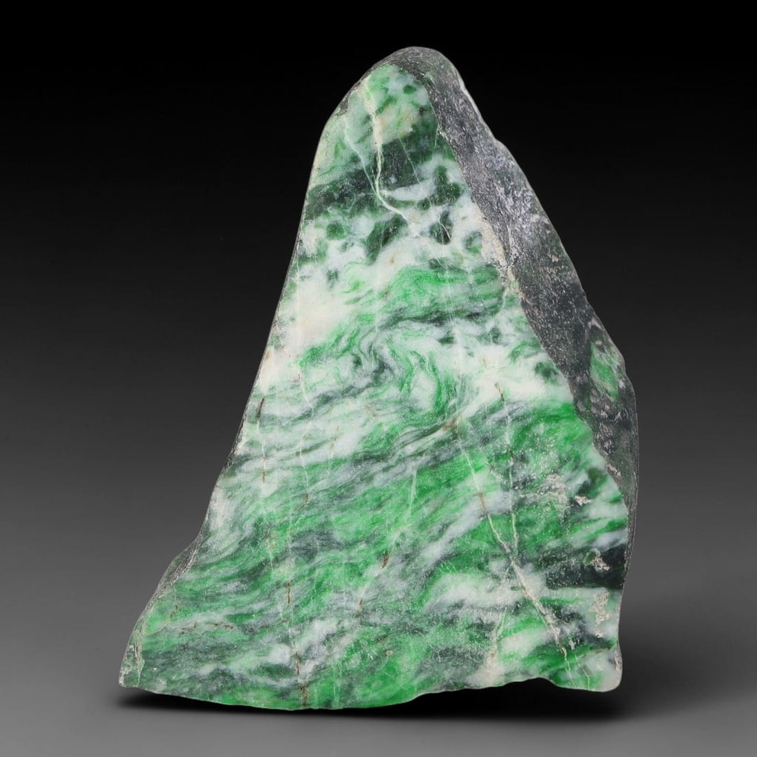 133ct Natural Type A Burmese Jadeite Jade Sliced Rough, 62YN: This specimen is a sliced rough block of natural Type A Burmese jadeite jade. The interior displays natural colour zoning with visible mineral veining and crystalline patterns typical of unprocessed j