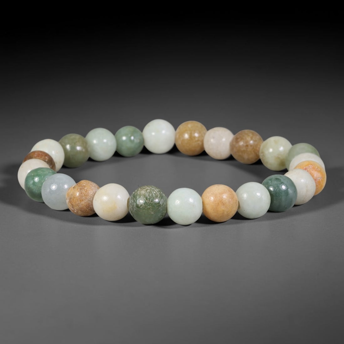 Natural Burmese Type A Multi-Colour Jadeite Jade Beaded Bracelet, 20TA: Strung from untreated natural Burmese Type A jadeite jade spherical beads with maximum bead dimension of 8.58mm, this bracelet strand features a sleek smooth polished finish showcasing mixed pale gree