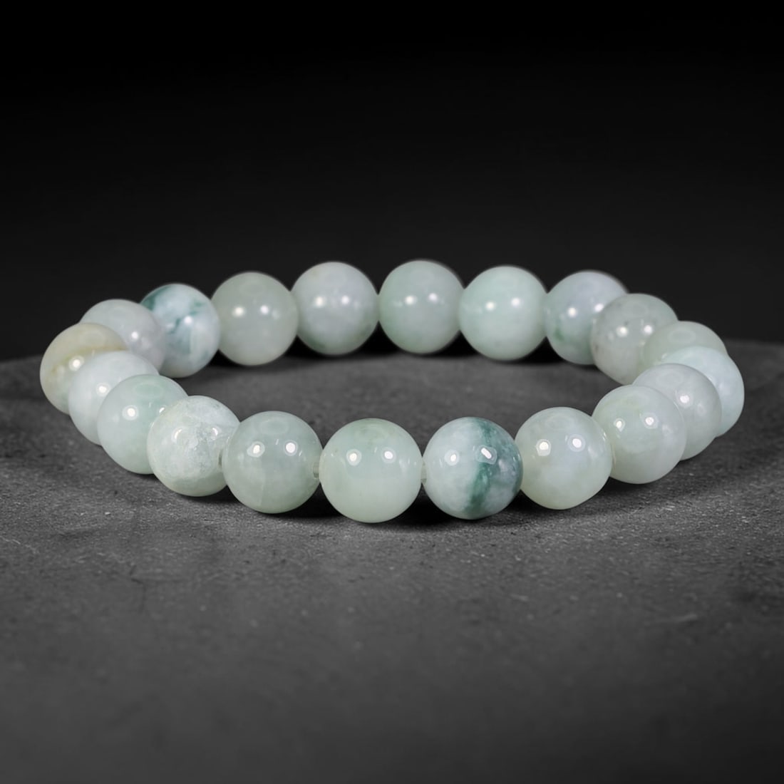 Natural Burmese Type A Pale Ice Floating Dark Green Jadeite Jade Beaded Bracelet, 11TA: This bracelet is handcrafted from fully untreated genuine Burmese Type A jadeite, featuring uniformly polished medium round beads with a translucent pale ice base tone, naturally adorned with flowing 