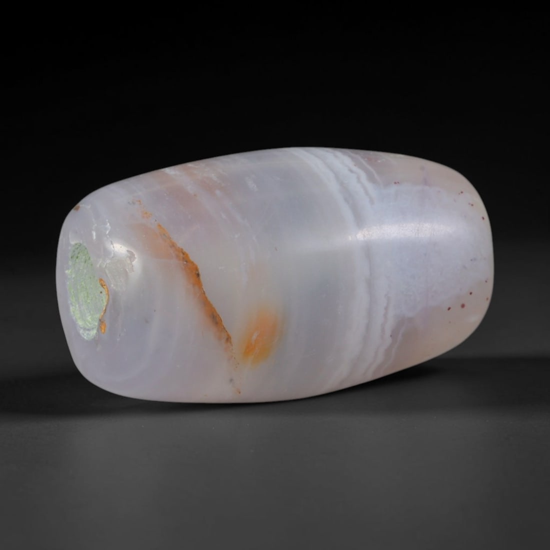 Ancient Mycenaean Greek Civilization Banded Agate Barrel Bead (1600-1100 BCE), 64XD: This antique banded agate barrel bead originates from Mycenaean Greek Civilization, an Aegean Bronze Age culture that imported and locally refined chalcedony beads to craft elite burial jewelry for pa