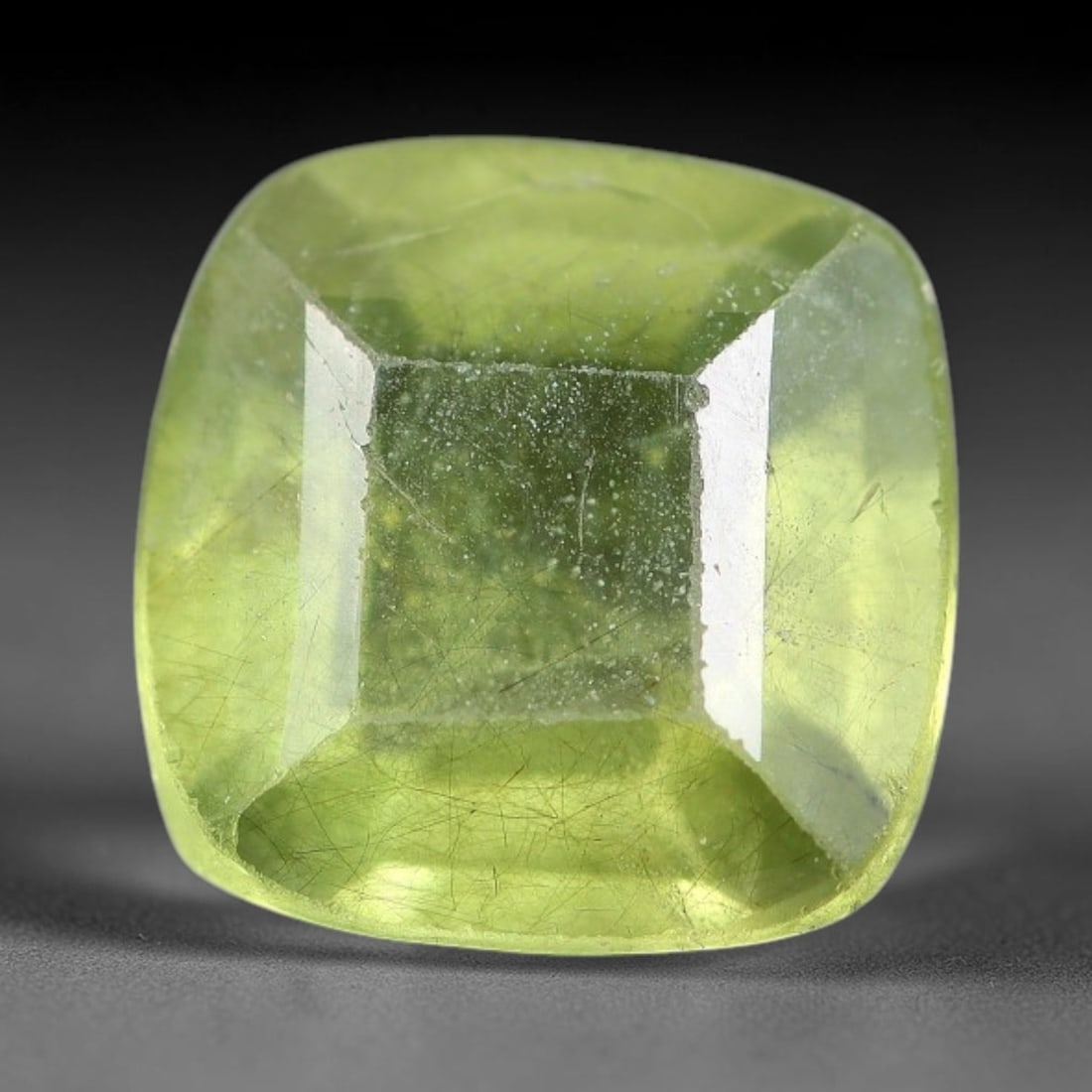 2.03 Carats Natural Green Rutilated Peridot Square Cushion Cut Loose Gemstone, 70WS: This rounded square cushion cut peridot presents a soft translucent lime green crystal densely interwoven with fine dark rutile needle silk, paired with abundant tiny frosty mineral micro specks scatt