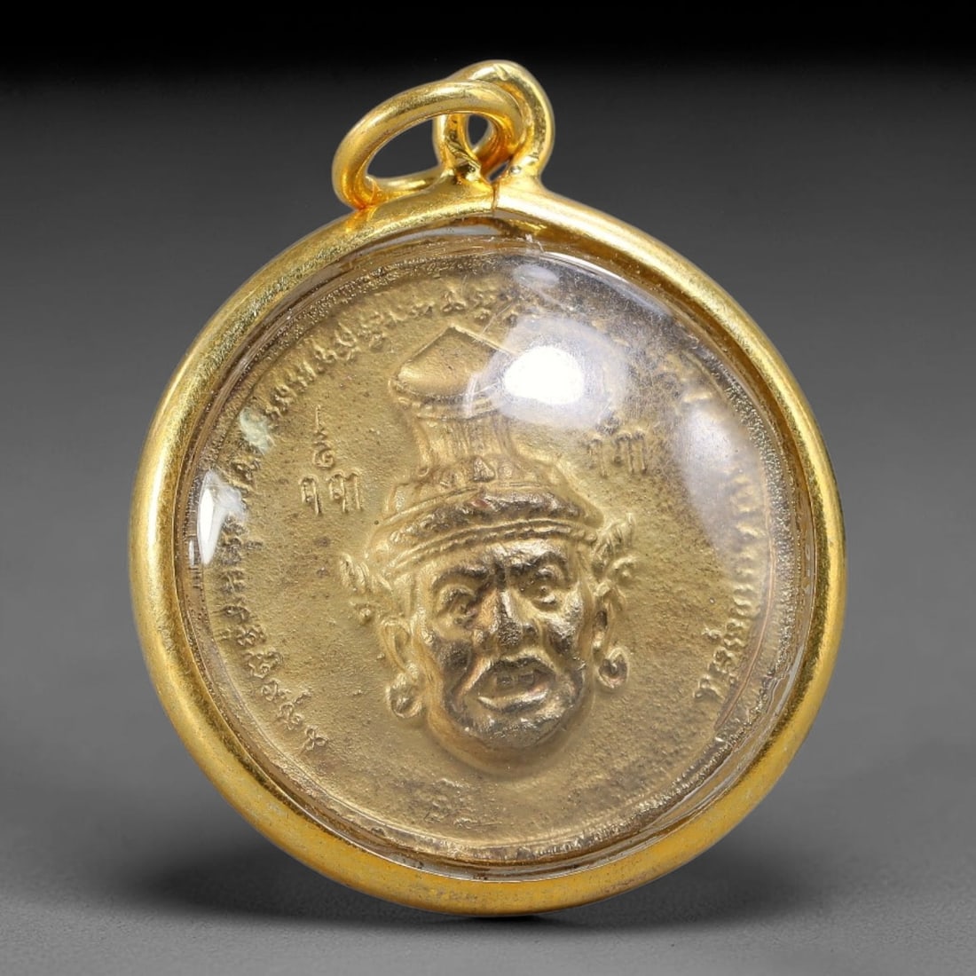 Thai Round Gold Casing Lersi Hermit & Ganesha Dual Sided Amulet Pendant, 69YY: Compact round gold plated sealed amulet sized 3.0x2.5cm, equipped with double gold jump rings for necklace wear. Clear transparent dome fully protects the two-sided golden metal medallion. Front side 