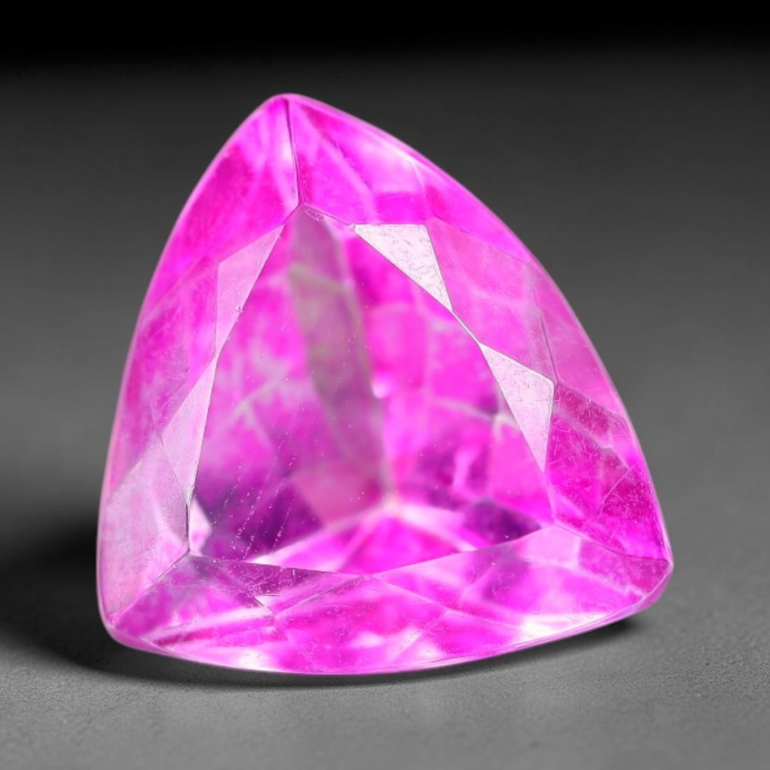 5.86 Carats Natural Brazilian Pink Topaz Trillion Faceted Loose Gemstone, 38TS: This specimen is composed of natural topaz sourced from Brazilian mineral deposits, processed via professional faceted lapidary techniques with consistent glossy polishing applied to the entire crysta