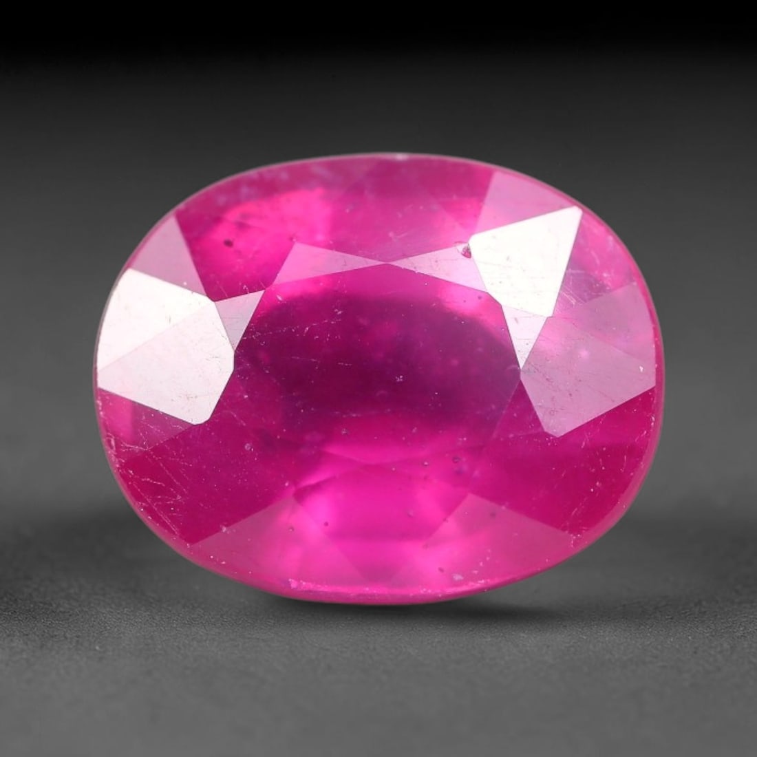 8.39 Carats Natural Madagascar Ruby Oval Faceted Loose Gemstone, 83TM: This sizable natural Madagascar ruby is cut into an oval brilliant faceted form, showcasing rich saturated crimson red hue characteristic of Malagasy corundum. Extensive natural internal silk veining,