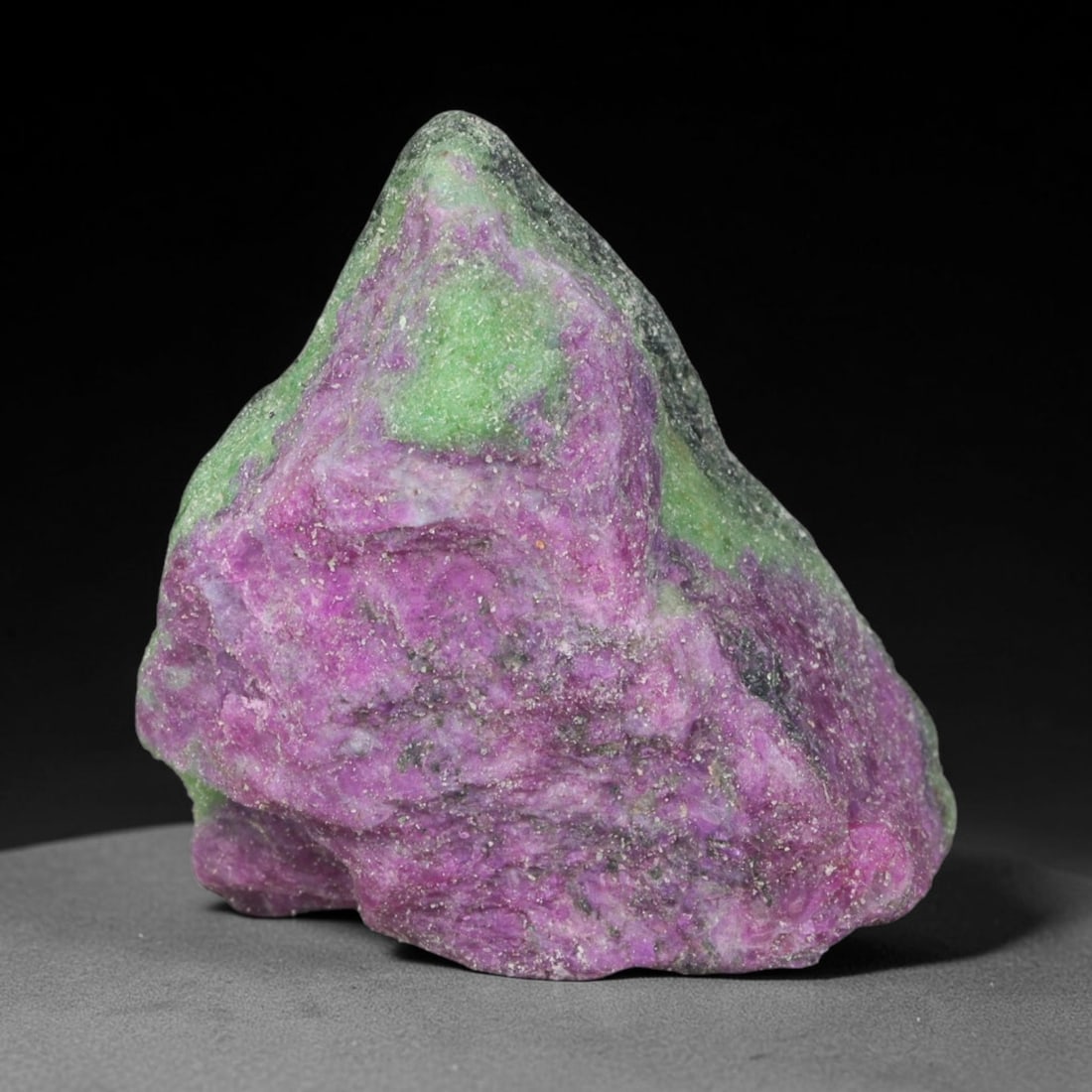 181.93ct Natural Tanzanian Ruby Zoisite Raw Rough Specimen Mineral Stone, 63YT: This unpolished mineral rough is natural ruby zoisite sourced from Tanzania, exhibiting distinct banded mineral segregation of vibrant green zoisite, magenta ruby crystals, and dark hornblende inclusi