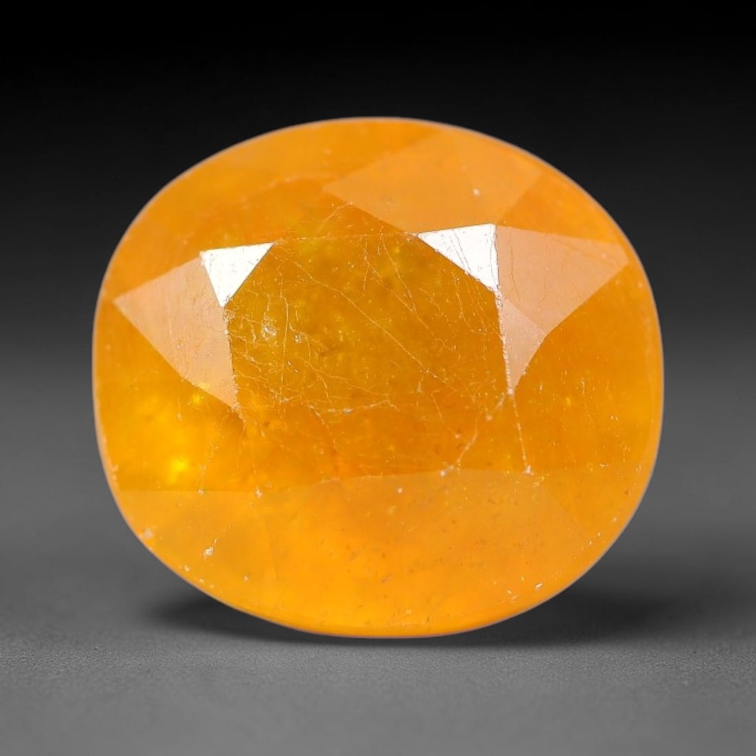 7.59 Carats Yellow Sapphire Oval Faceted Loose Gemstone, 87TM: This classic oval faceted sapphire displays rich saturated yelow color glowing through crisp polished multi-facet cuts, featuring natural fine internal fissures and tiny scattered mineral micro specks