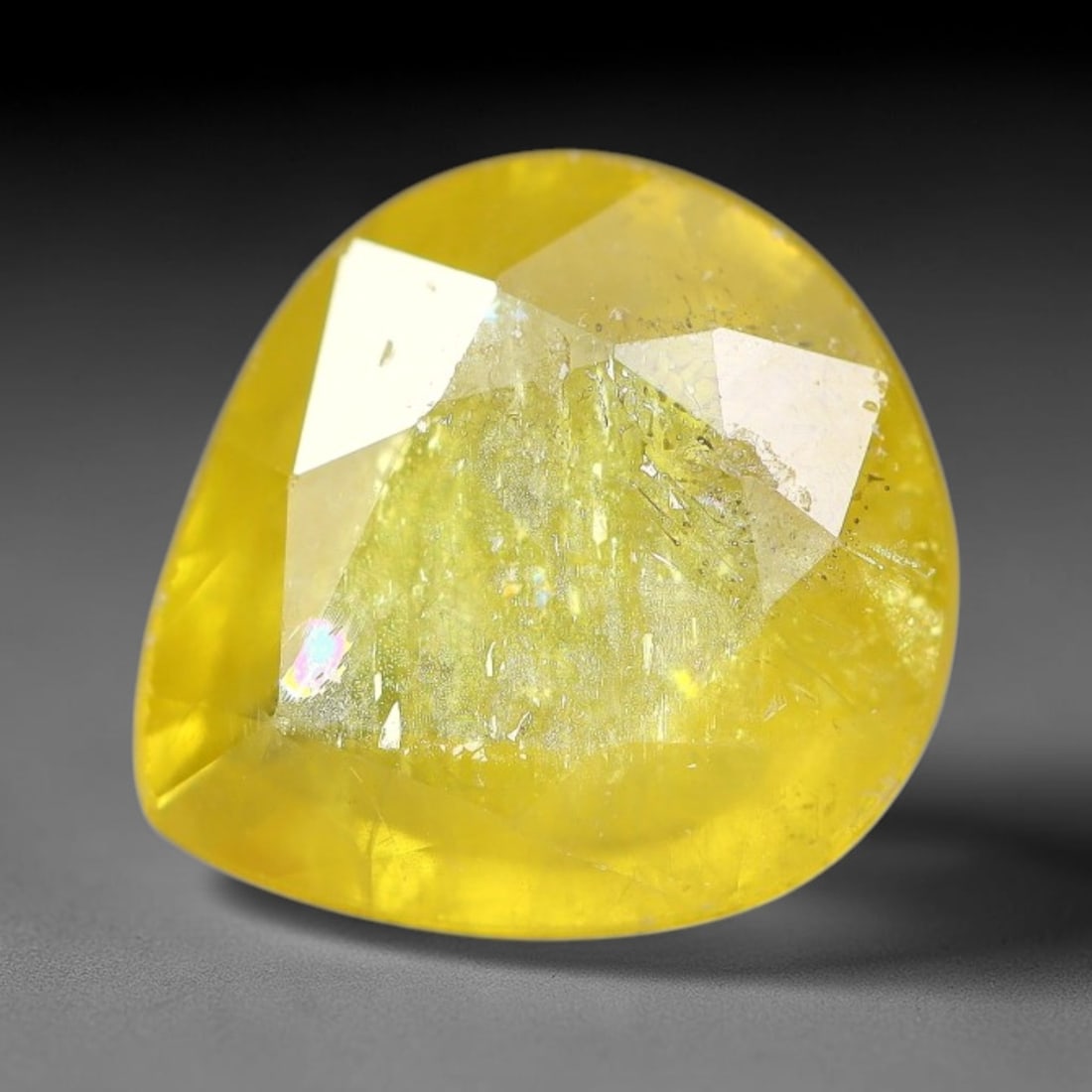 2.23 Carats Natural Yellow Sapphire Oval Faceted Loose Gemstone, 47YW: This natural yellow sapphire features a classic oval brilliant faceted cut, holding consistent warm golden-yellow color throughout the corundum crystal. Fine microscopic mineral specks and faint natur