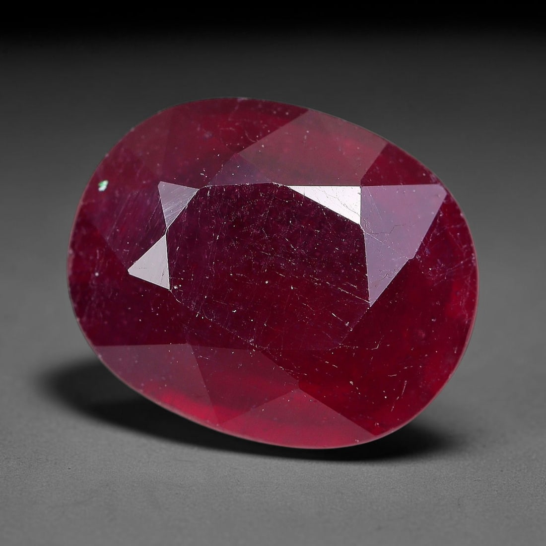 3.63 Carats Natural Madagascar Ruby Oval Faceted Loose Gemstone, 36TM: This sizable natural Madagascar ruby is cut into an oval brilliant faceted form, showcasing rich saturated crimson red hue characteristic of Malagasy corundum. Extensive natural internal silk veining,