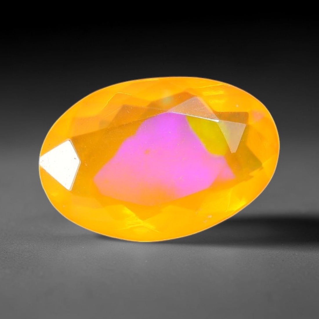 1.44 Carats Natural Ethiopian Welo Orange Fire Opal Oval Faceted Loose Gemstone, 74TS: This opal material is mined from the Welo deposits of Ethiopia and processed with professional faceted lapidary work with uniform polished facets across the gem surface. Natural subtle internal textur