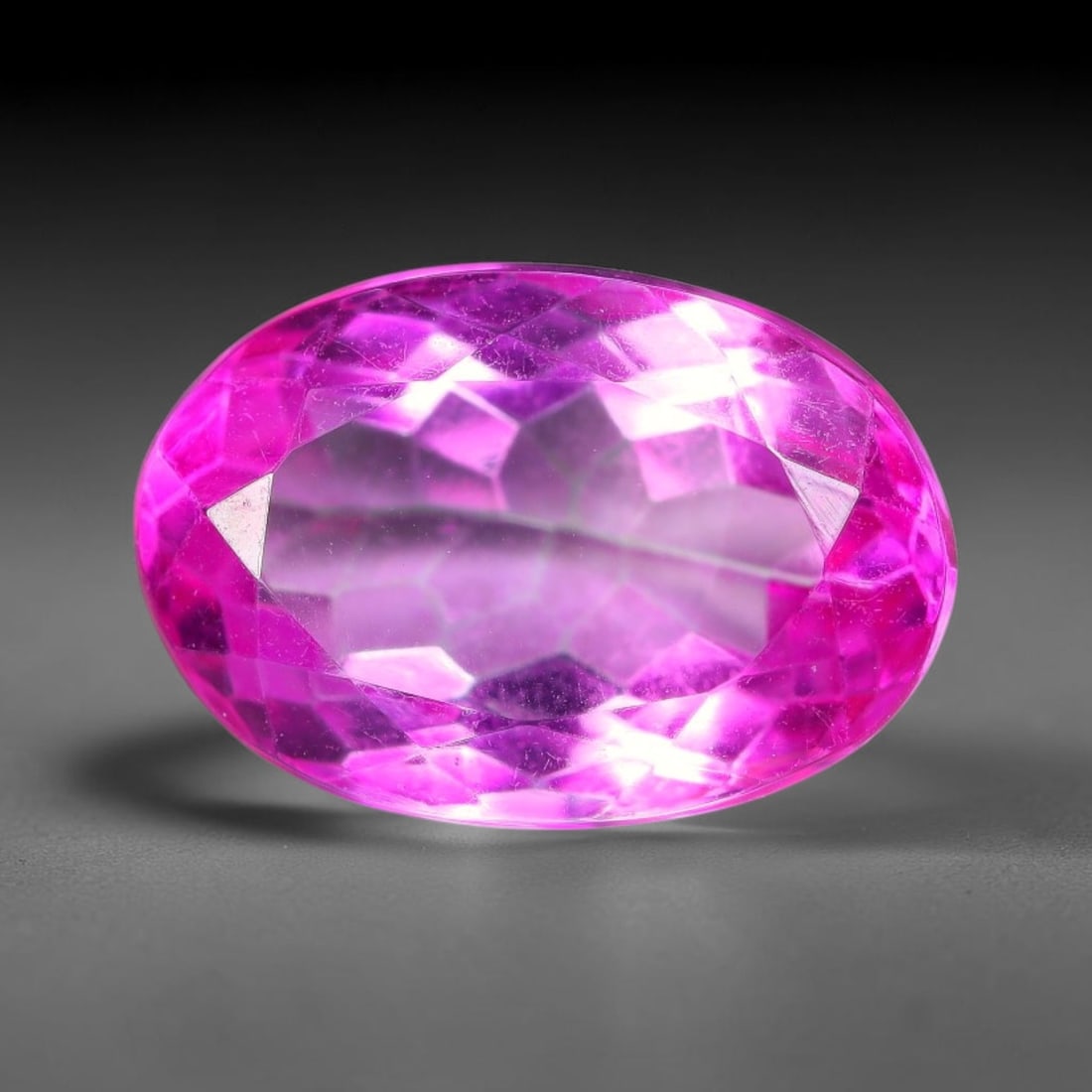 5.04 Carats Natural Brazilian Pink Topaz Oval Faceted Loose Gemstone, 9TM: This specimen is composed of natural topaz sourced from Brazilian mineral deposits, processed via professional faceted lapidary techniques with consistent glossy polishing applied to the entire crysta