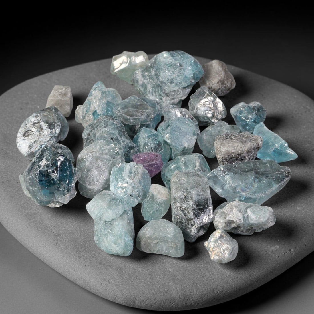 206.38ct Natural Cambodian Blue Zircon Rough Parcel Loose Gemstone, 77YT: This parcel consists of natural unpolished blue zircon rough crystals with translucent sky-blue to teal hues, featuring natural crystalline textures and facets. Minor matrix and inclusions are visible