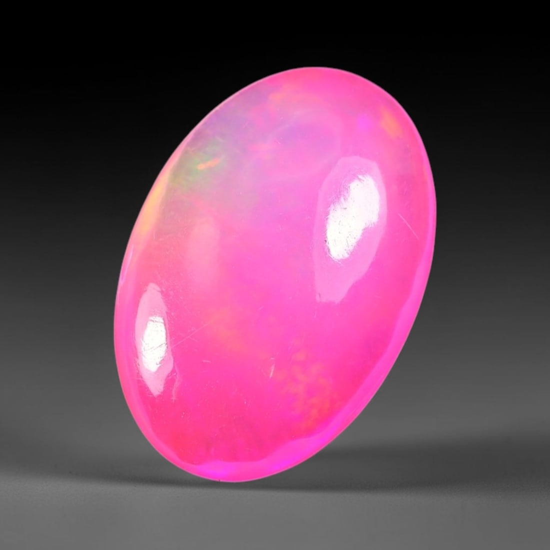 2.74ct Natural Ethiopian Welo Pink Fire Opal Cabochon Loose Gemstone, 83TS: This opal is sourced from Ethiopian Welo natural opal deposits and shaped into a smooth polished cabochon form with refined lapidary finishing work. Bright warm pink base accompanied by vivid internal