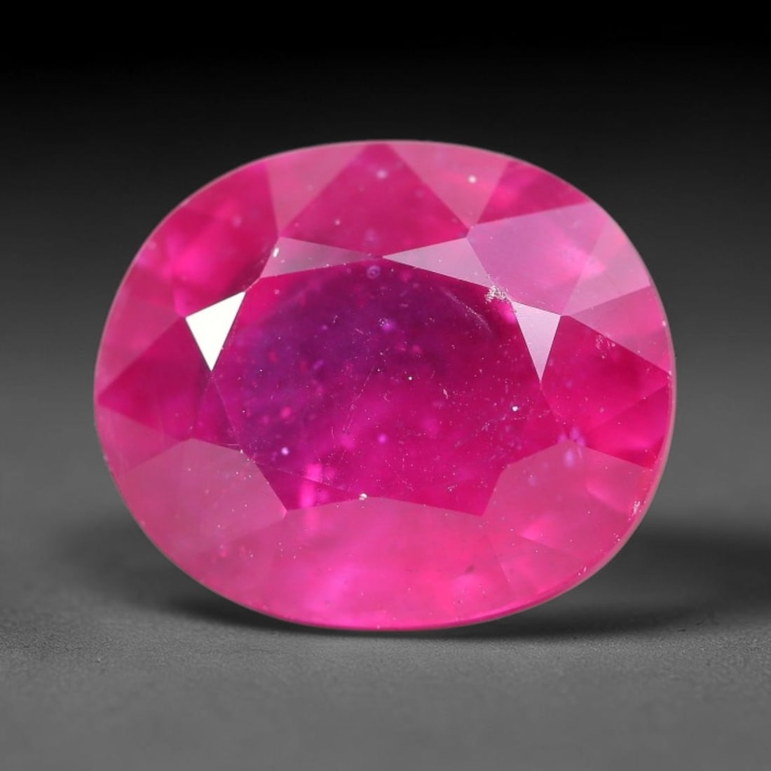 9.38 Carats Natural Madagascar Ruby Oval Faceted Loose Gemstone, 74TM: This sizable natural Madagascar ruby is cut into an oval brilliant faceted form, showcasing rich saturated crimson red hue characteristic of Malagasy corundum. Extensive natural internal silk veining,