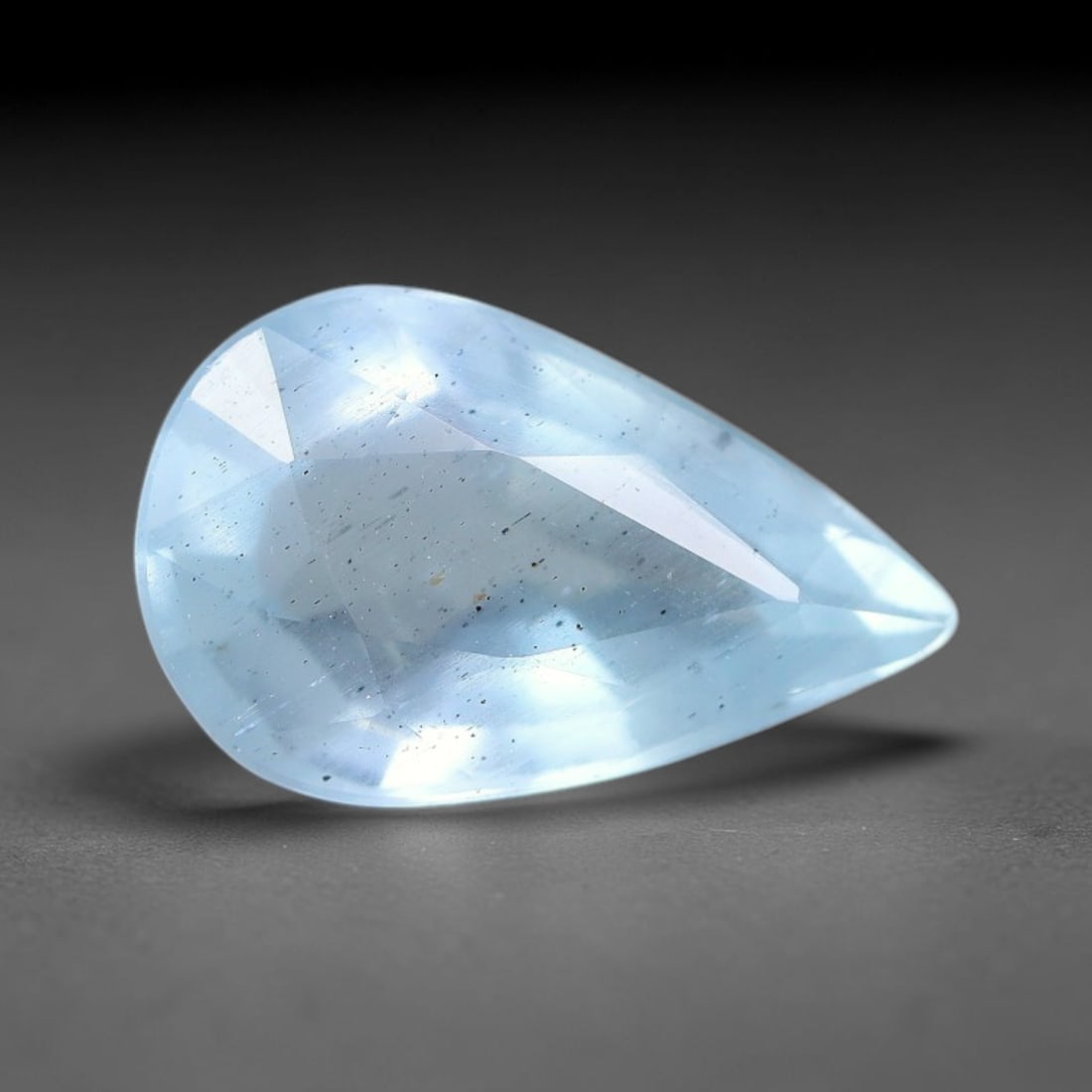 2.77ct Natural Pale Blue Aquamarine Oval Faceted Gemstone, 7YW: This faceted gemstone is natural aquamarine, cut in an oval form with polished facets displaying its soft pale blue hue. Visible natural internal features occur within the crystal, consistent with unt