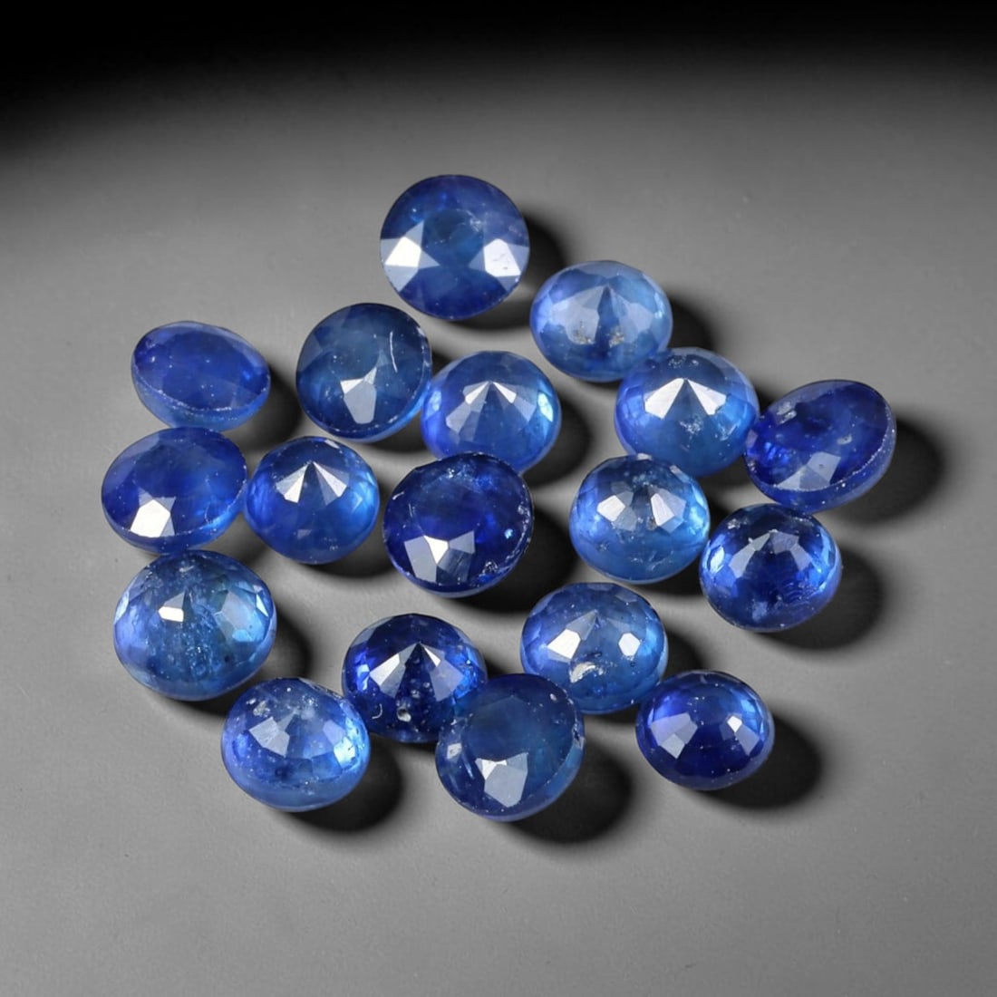 4.41ct Natural Royal Blue Sapphire Round Rose Cut Loose Gemstone, 98YW: This parcel consists of multiple natural sapphire gemstones, each fashioned with a round rose cut displaying a rich royal blue hue. Natural internal inclusions are visible within the corundum crystals