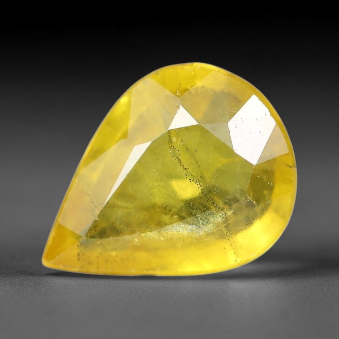 1.54 Carats Natural Yellow Sapphire Pear Faceted Loose Gemstone, 56YW: This natural yellow sapphire features a classic pear brilliant faceted cut, holding consistent warm golden-yellow color throughout the corundum crystal. Fine microscopic mineral specks and faint natur