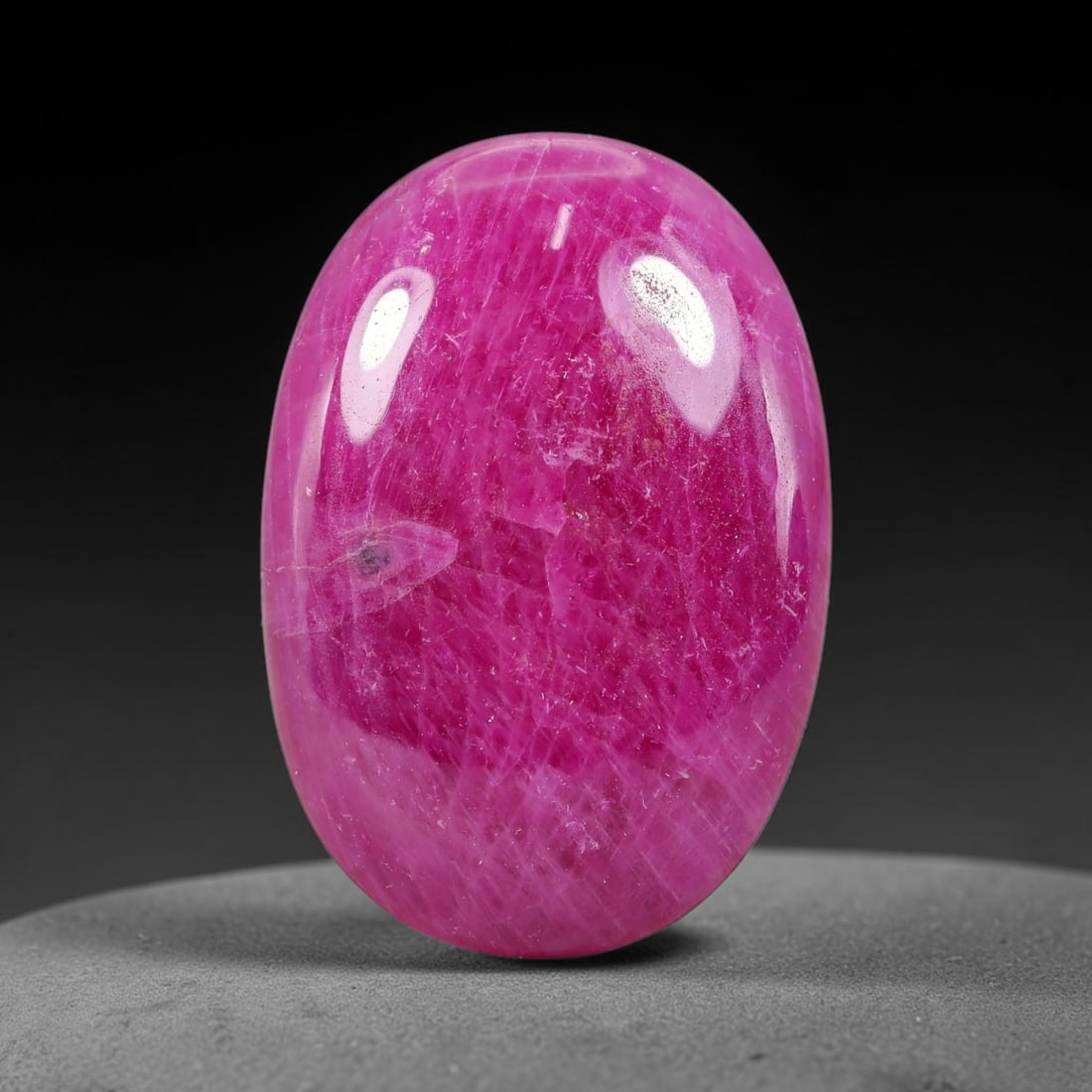 18.90 Carats Natural Mozambique Ruby Cabochon Loose Gemstone, 45TM: This ruby originates from Mozambique natural mineral deposits and receives professional cabochon grinding and polishing treatment to form a smooth glossy exterior surface. Tiny mineral particles and n
