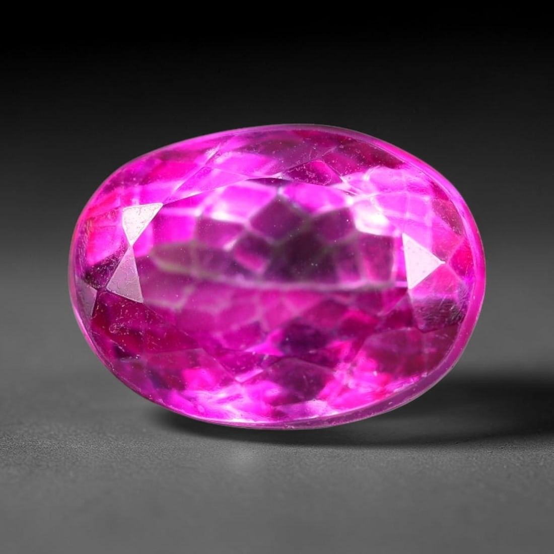 6.72 Carats Natural Brazilian Pink Topaz Oval Faceted Loose Gemstone, 99TM: This specimen is composed of natural topaz sourced from Brazilian mineral deposits, processed via professional faceted lapidary techniques with consistent glossy polishing applied to the entire crysta