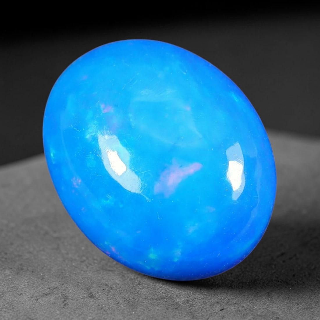 3.67ct Natural Ethiopian Welo Blue Fire Opal Cabochon Loose Gemstone, 86TS: This opal is sourced from Ethiopian Welo natural opal deposits and shaped into a smooth polished cabochon form with refined lapidary finishing work. Bright warm blue base accompanied by vivid internal