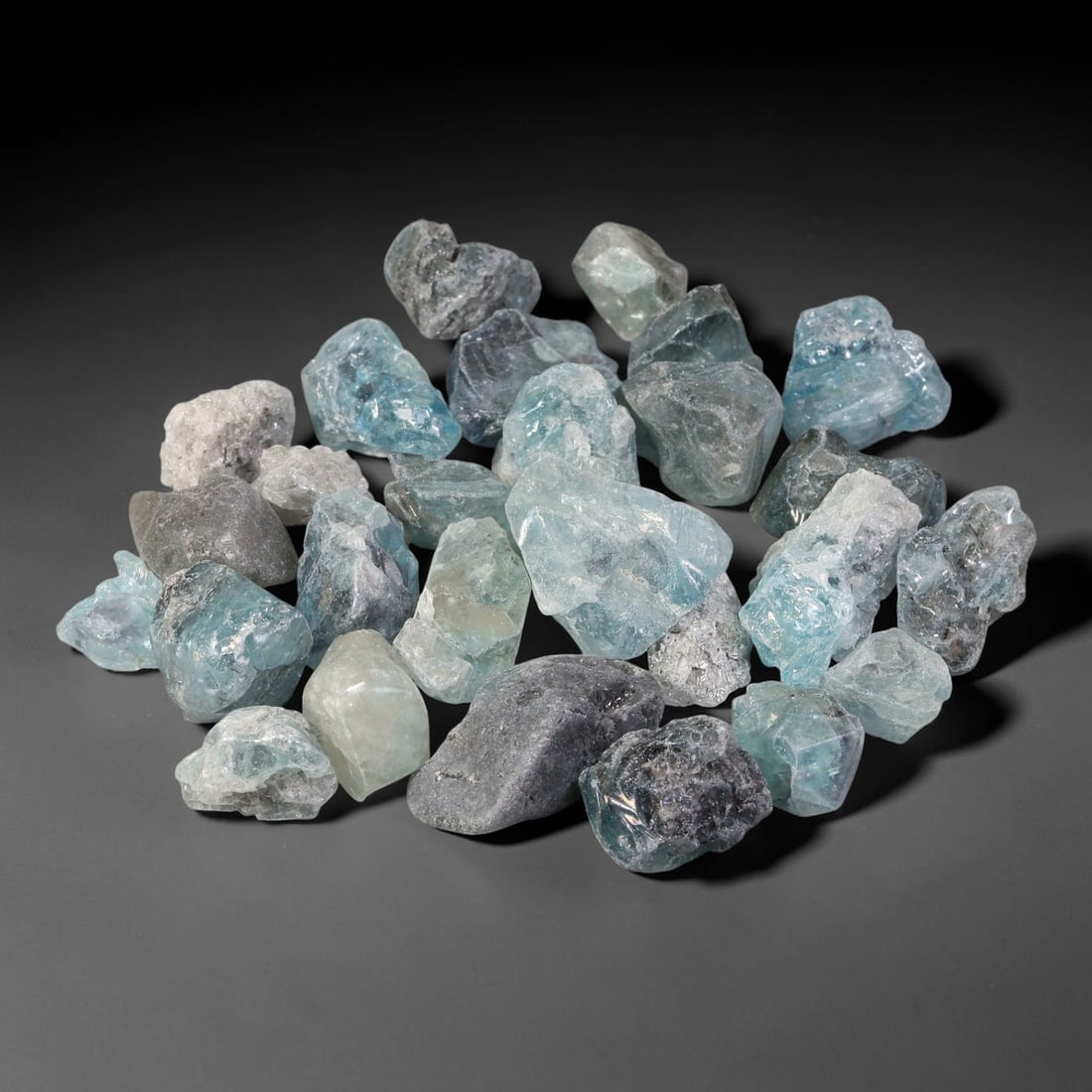 251.66ct Natural Cambodian Blue Zircon Rough Parcel Loose Gemstone, 75YT: This parcel consists of natural unpolished blue zircon rough crystals with translucent sky-blue to teal hues, featuring natural crystalline textures and facets. Minor matrix and inclusions are visible