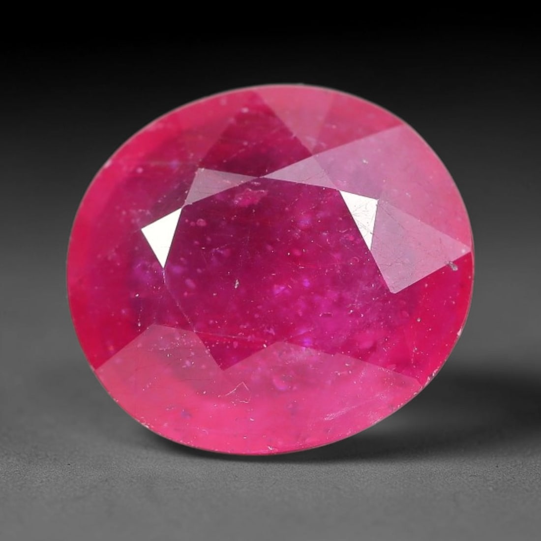 6.35 Carats Natural Madagascar Ruby Oval Faceted Loose Gemstone, 76TM: This sizable natural Madagascar ruby is cut into an oval brilliant faceted form, showcasing rich saturated crimson red hue characteristic of Malagasy corundum. Extensive natural internal silk veining,