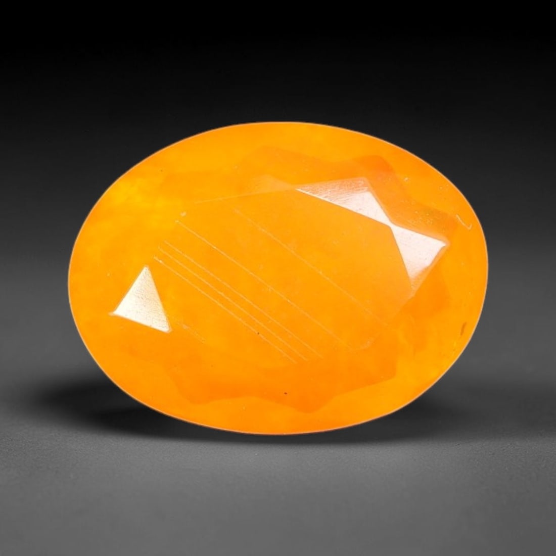 1.43 Carats Natural Ethiopian Welo Orange Fire Opal Oval Faceted Loose Gemstone, 77TS: This opal material is mined from the Welo deposits of Ethiopia and processed with professional faceted lapidary work with uniform polished facets across the gem surface. Natural subtle internal textur