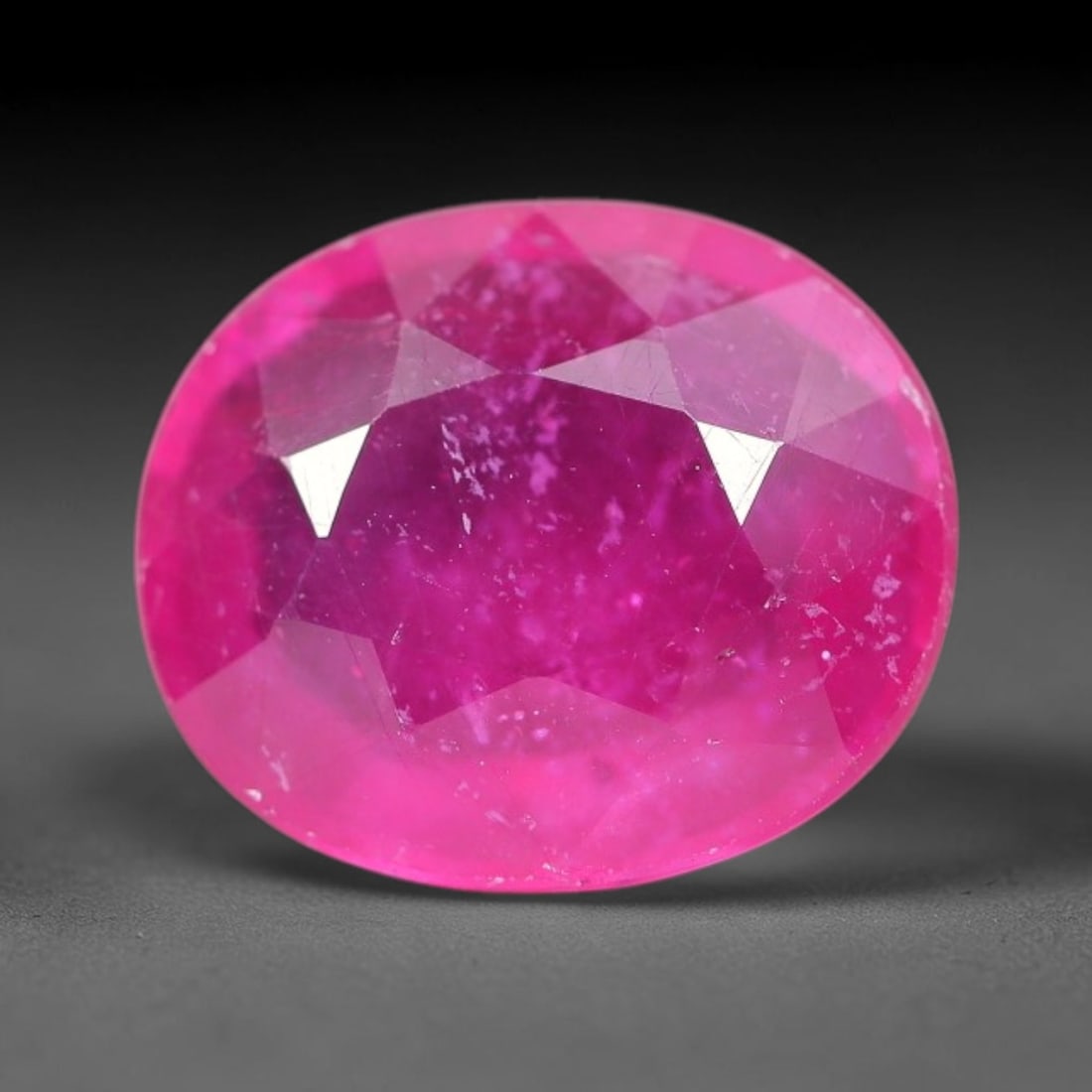 6.15 Carats Natural Madagascar Ruby Oval Faceted Loose Gemstone, 77TM: This sizable natural Madagascar ruby is cut into an oval brilliant faceted form, showcasing rich saturated crimson red hue characteristic of Malagasy corundum. Extensive natural internal silk veining,