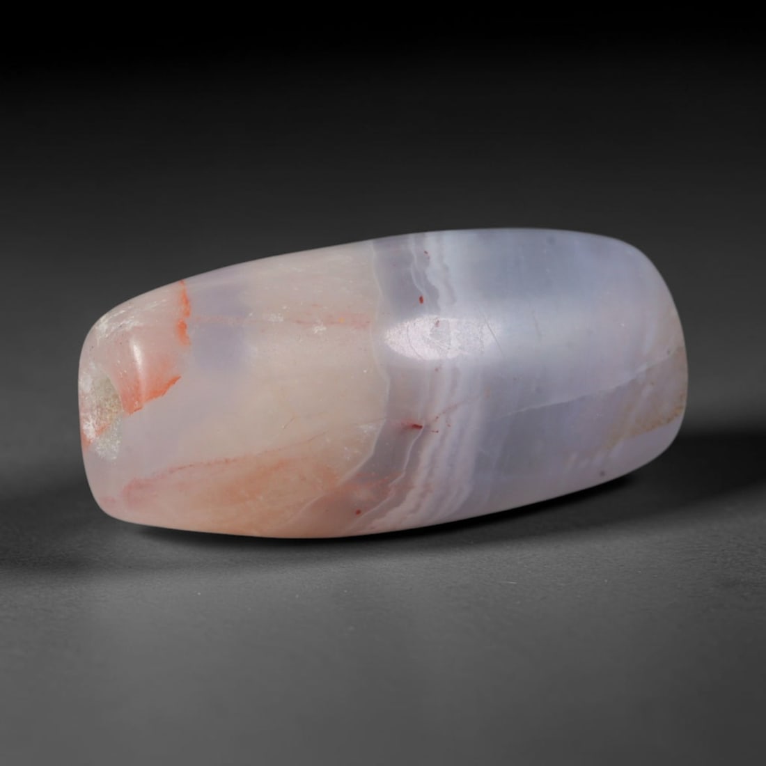 Ancient Sasanian Persian Empire Banded Agate Cylinder Bead (224-651 CE), 77XD: This antique banded agate cylinder bead originates from the Sasanian Persian Empire, a late antique West Asian civilization renowned for producing delicate layered chalcedony talismans crafted for Zor